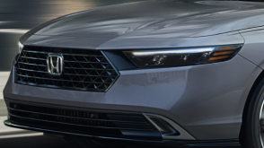 3/4 closeup of the front of a grey Accord. 