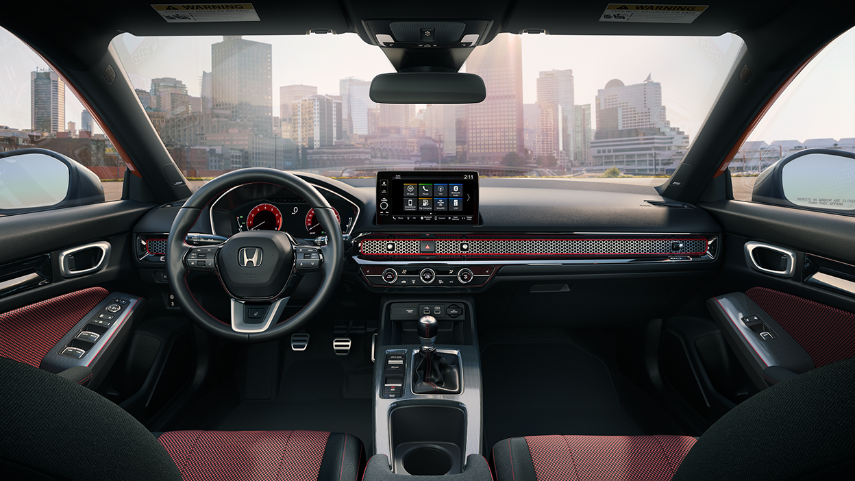 Panoramic view of steering wheel and front dashboard.